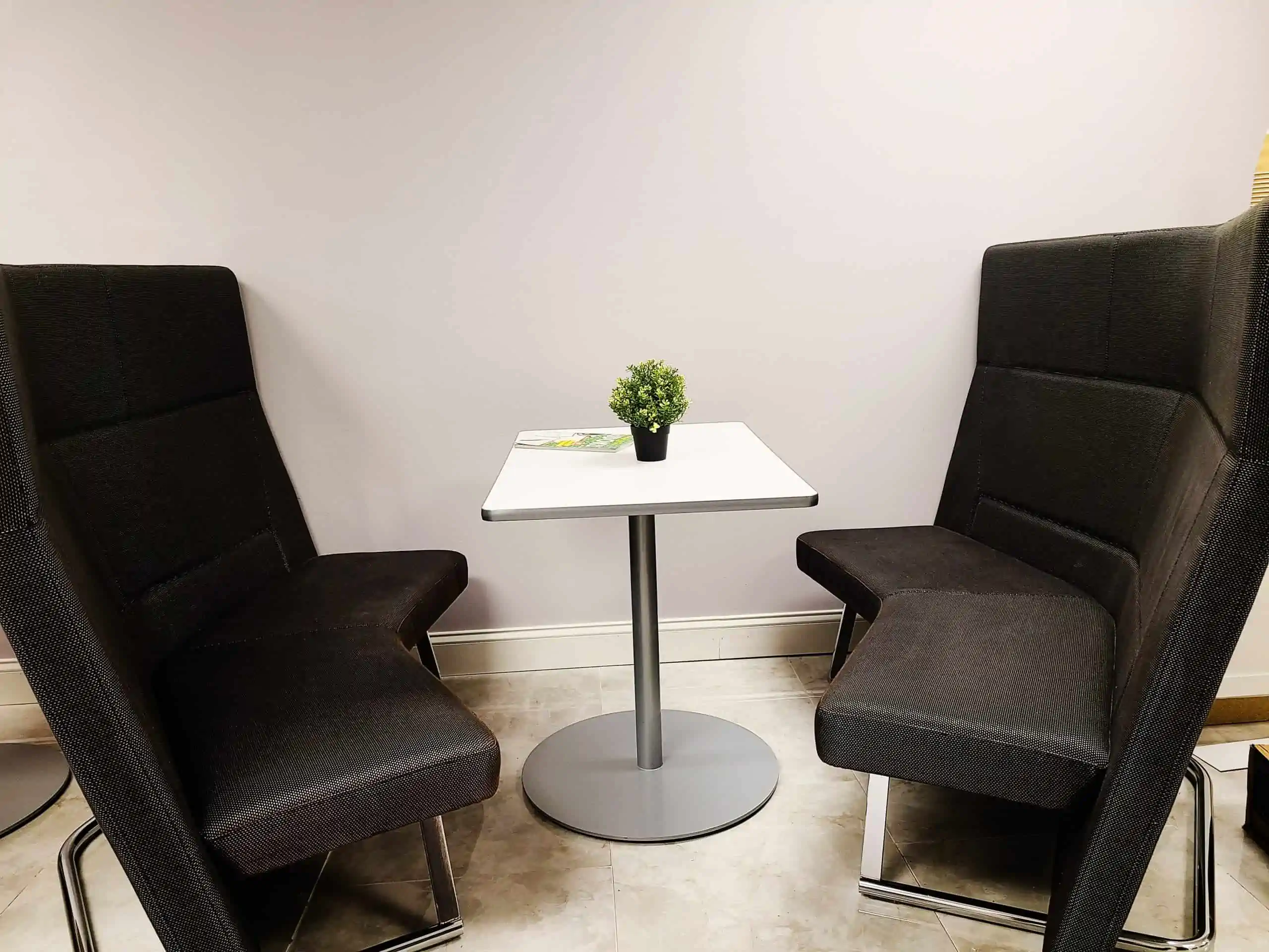 two comfortable booth seats and table at arlington heights coworking
